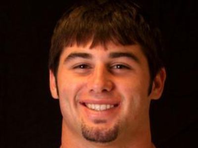 Koe Wetzel has a short hair and a beard on his chin.